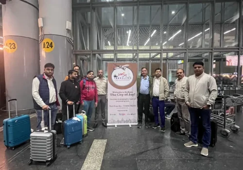 people are standing with travelites board