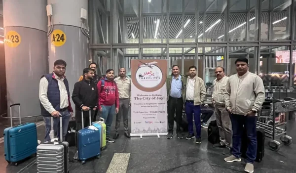 people are standing with travelites board
